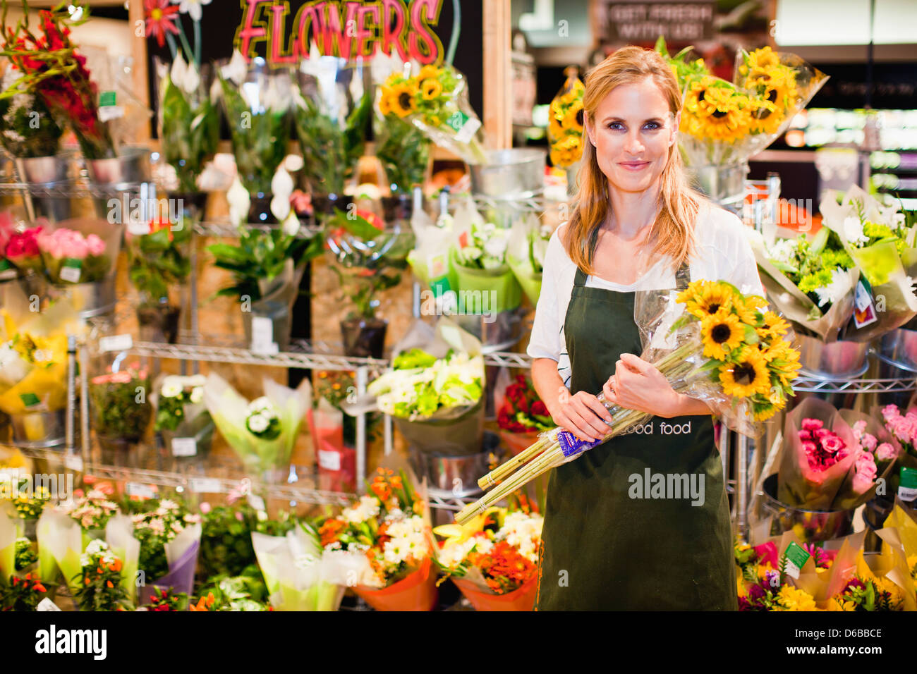 Grocer working in florist section Stock Photo