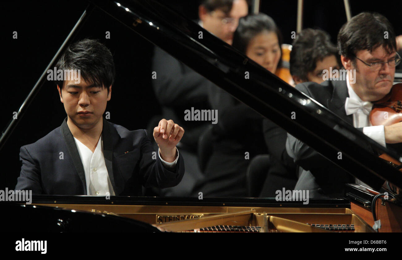 Chinese pianist Lang Lang performs with the NDR-symphony orchestra during the final concert of the Schleswig-Holstein Music Festival in Kiel, Germany, 25 August 2012. Photo: Markus Scholz Stock Photo