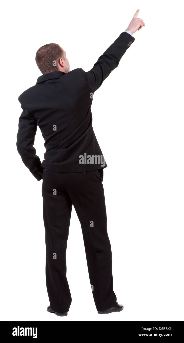 Back view of pointing business man. Gesticulating young guy in black