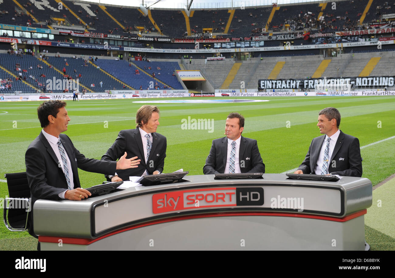 TV presenter Sebastian Hellmann (L-R) and soccer experts Jan-Aage Fjoertoft, Lothar Matthaeus and Markus Merk appear at the expert desk of broadcaster Sky during the German Bundesliga match between Eintracht Frankfurt and Bayer 04 Leverkusen at the Commerzbank-Arena in Frankfurt am Main, Germany, 25 August 2012. Photo: Arne Dedert Stock Photo