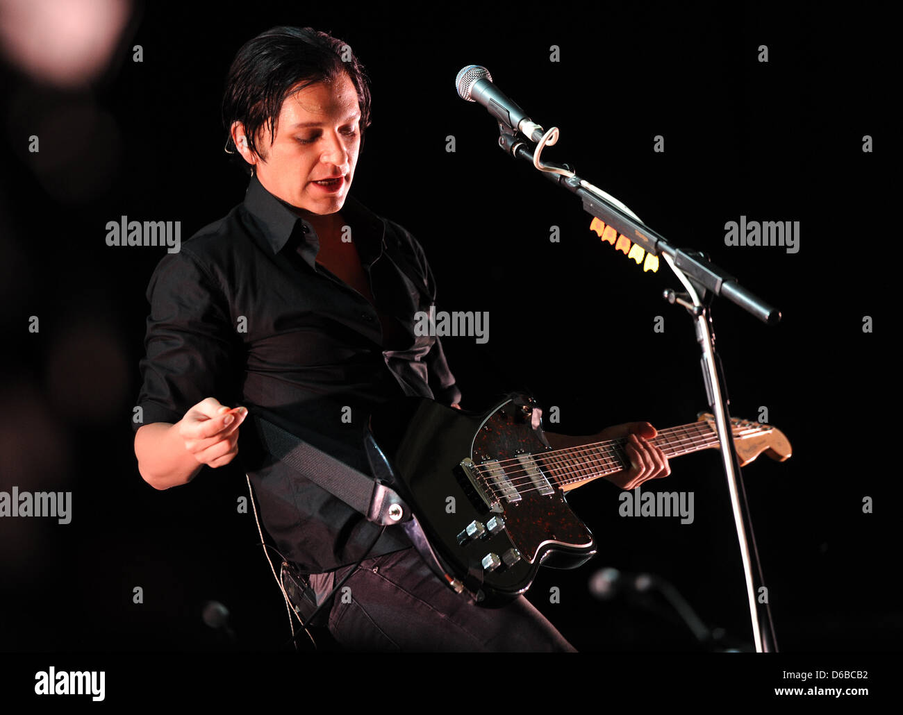 Singer Brian Molko of the British band Placebo performs on stage at the  Veltins-Arena in Gelsenkirchen, Germany, 25 August 2012. Tens of thousands  of people attended the one-day festival 'Rock im Pott'.