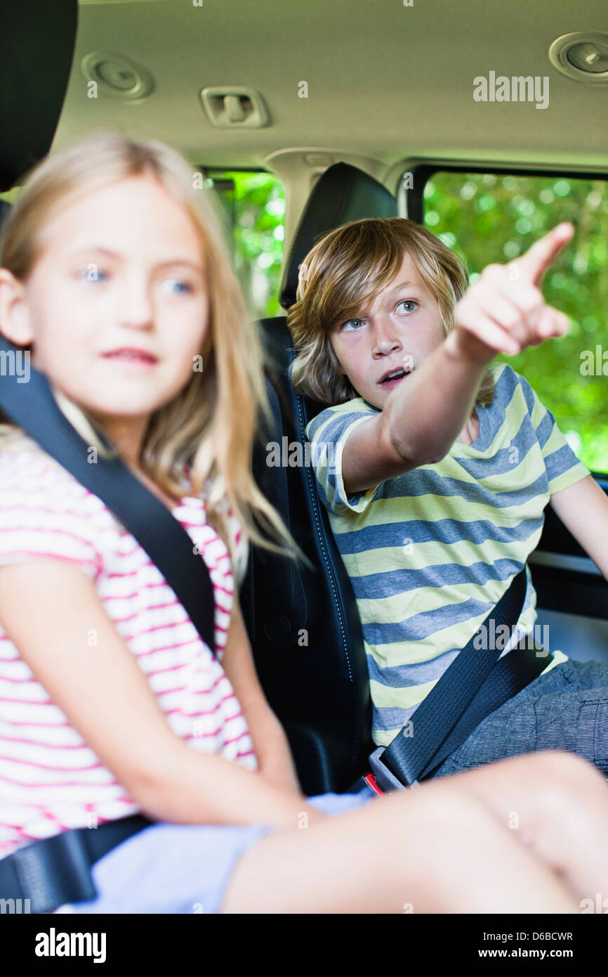 Children sitting in backseat of car Stock Photo