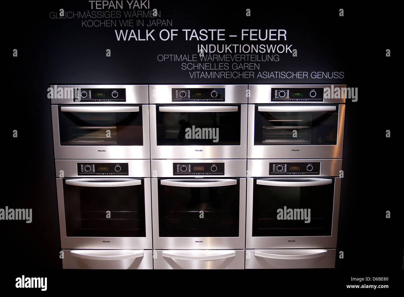 Several induction woks by manufacturer Miele are on display at the