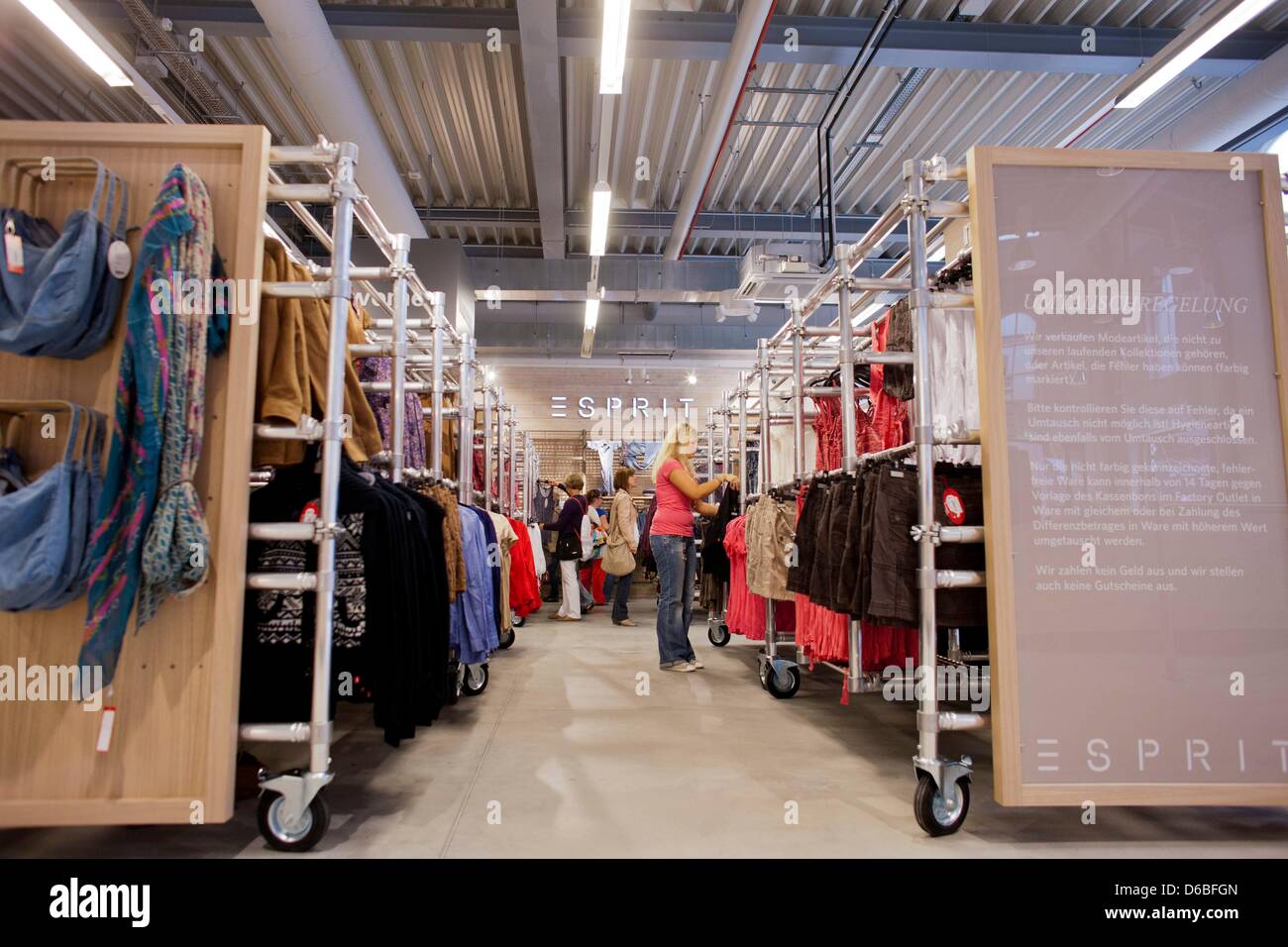Shoppers look at clothes in the store of fashion company Esprit at the FOC  Ochtrup in Ochtrup, Germany, 30 August 2012. The only FActory-Outlet-Center  in Nort Rhine-Westphalia is now open for business.