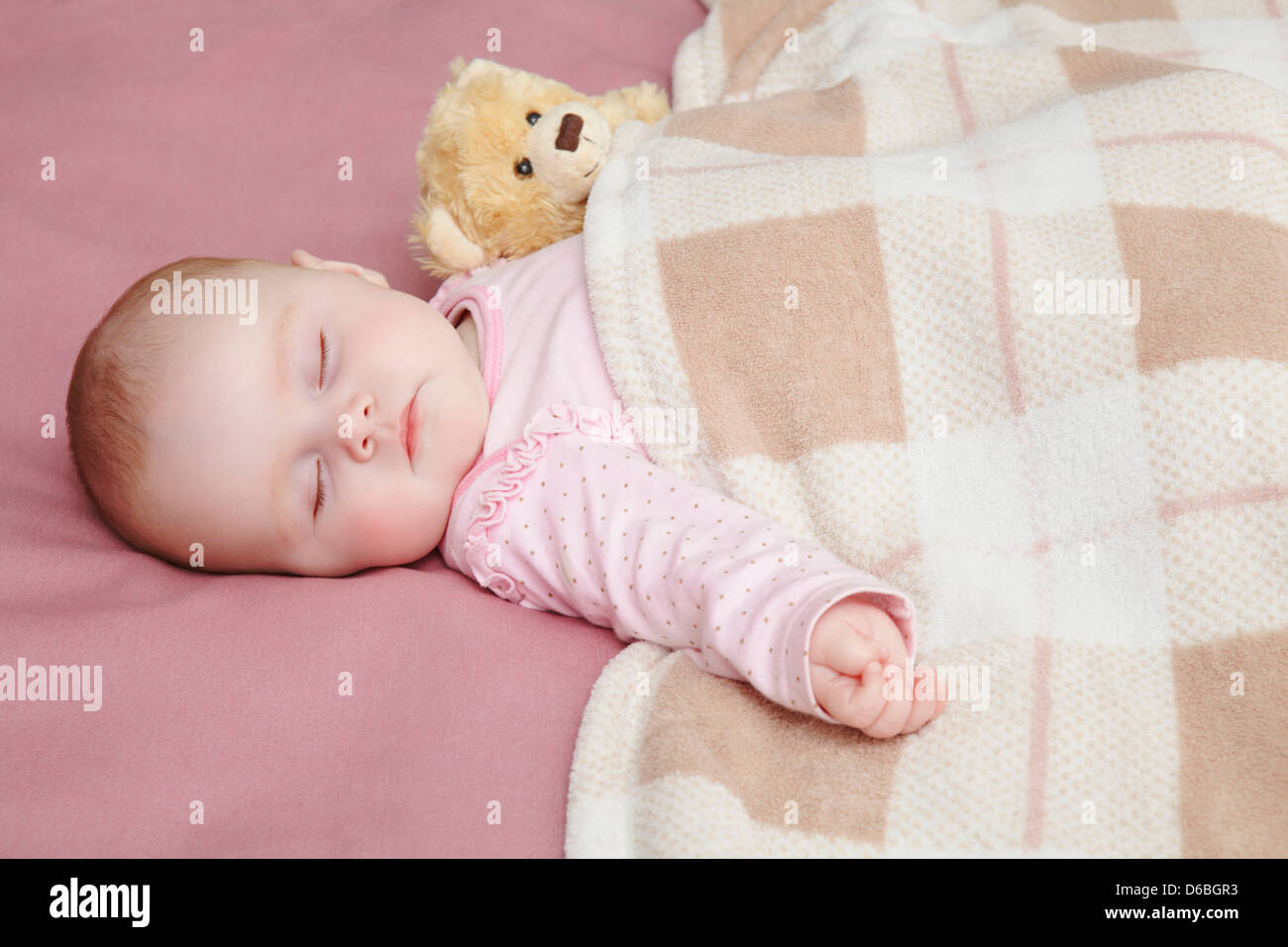 Baby girl sleeping in bed Stock Photo Alamy