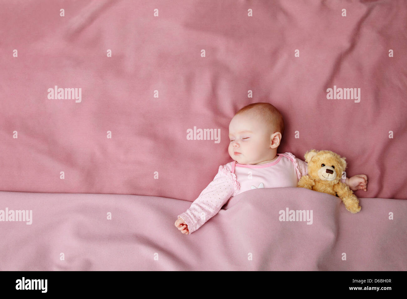 Baby girl sleeping in bed Stock Photo Alamy