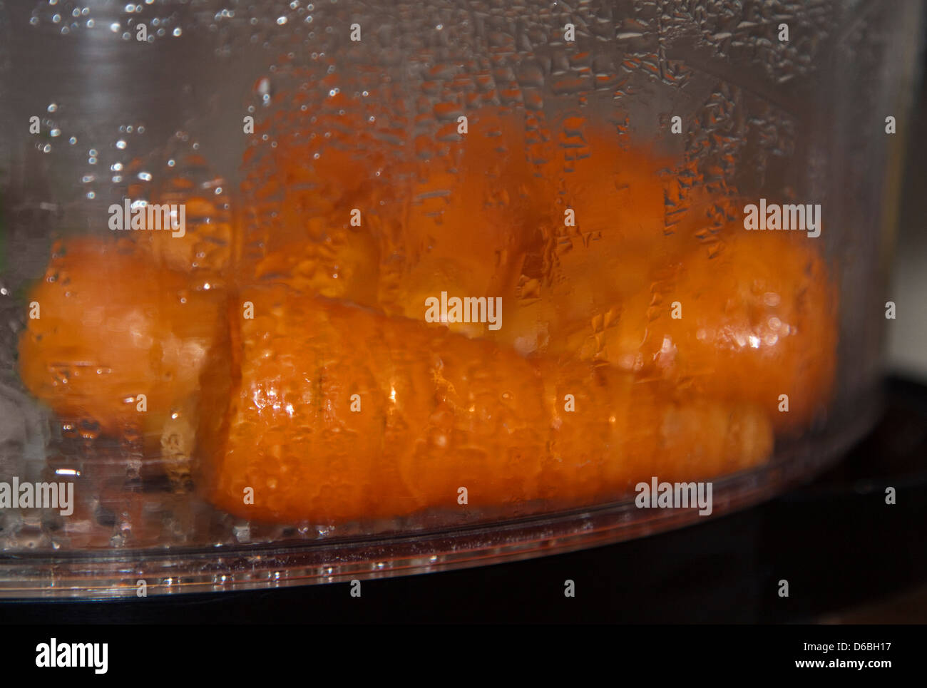 Carrots cooking in Electric Steamer Stock Photo Alamy