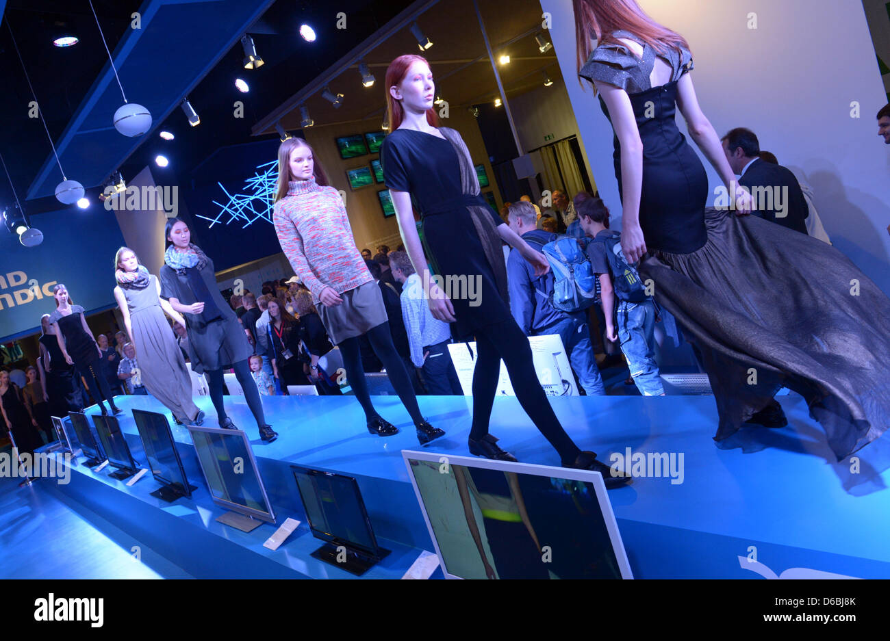 A fashion show is presented at a booth of the company Grundig at the Berlin Radio Show (IFA) in Berlin, Germany, 31 August 2012. Until 05 September, 240,000 visitors are expected to the consumer electronics and home appliances trade fair. Photo: RAINER JENSEN Stock Photo