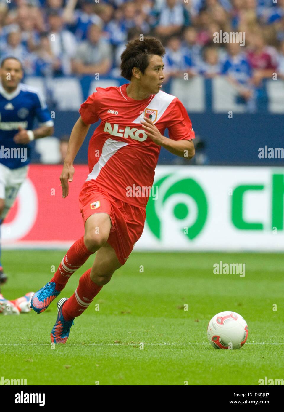 Augsburg's Ja-Cheol Koo is pictured in action during the Bundesliga soccer match between FC Schalke 04 and FC Augsburg at VeltinsArena in Gelsenkirchen, Germany, 01 September 2012. Photo: BERND THISSEN   (ATTENTION: EMBARGO CONDITIONS! The DFL permits the further utilisation of up to 15 pictures only (no sequntial pictures or video-similar series of pictures allowed) via the intern Stock Photo