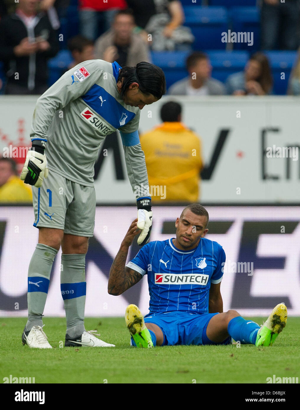 Hoffenheim's goalkeeper Tim Wiese (L) talks to his teammate Fabian Johnson after the German Bundesliga soccer match between TSG 1899 Hoffenheim and Eintracht Frankfurt at the Rhein-Neckar-Arena in Sinsheim, Germany, 01 September 2012. Photo: UWE ANSPACH   (ATTENTION: EMBARGO CONDITIONS! The DFL permits the further utilisation of up to 15 pictures only (no sequntial pictures or vide Stock Photo