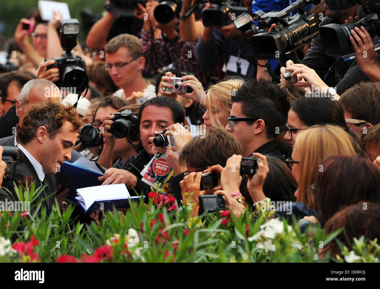 US actor Joaquin Phoenix (L) arrives at the premiere of the movie 'The Master' at Palazzo del Cinema during the 69th Venice International Film Festival, in Venice, Italy, 01 September 2012. Photo: Jens Kalaene dpa Stock Photo