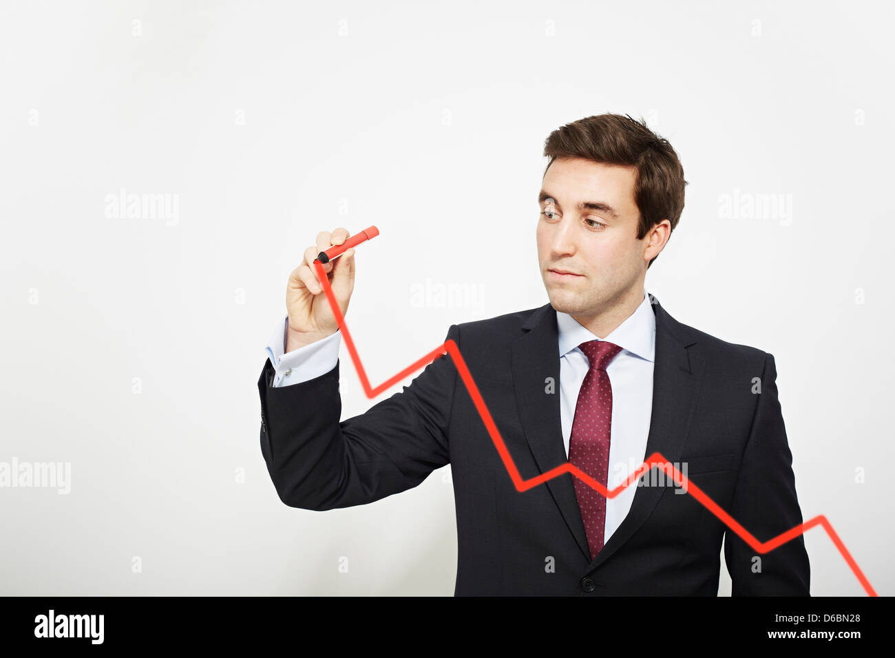 Businessman drawing graph in air Stock Photo