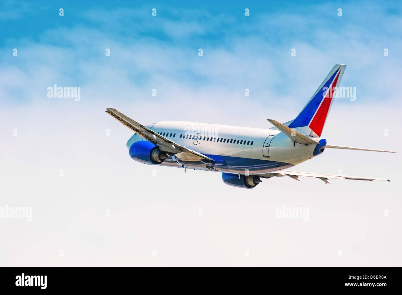 An airplane flying in sky Stock Photo - Alamy