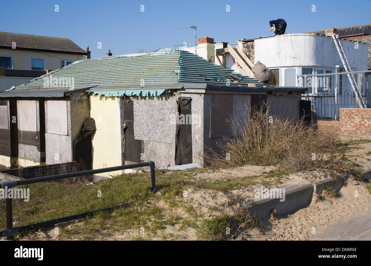 Building repairs taking place on housing, Jaywick, Essex, England Stock Photo