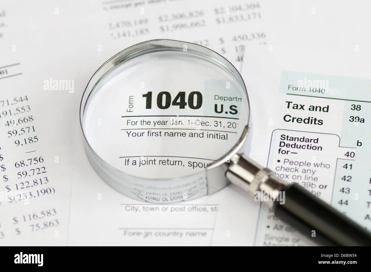 Tax form 1040 for US individual tax return with magnifier. Stock Photo