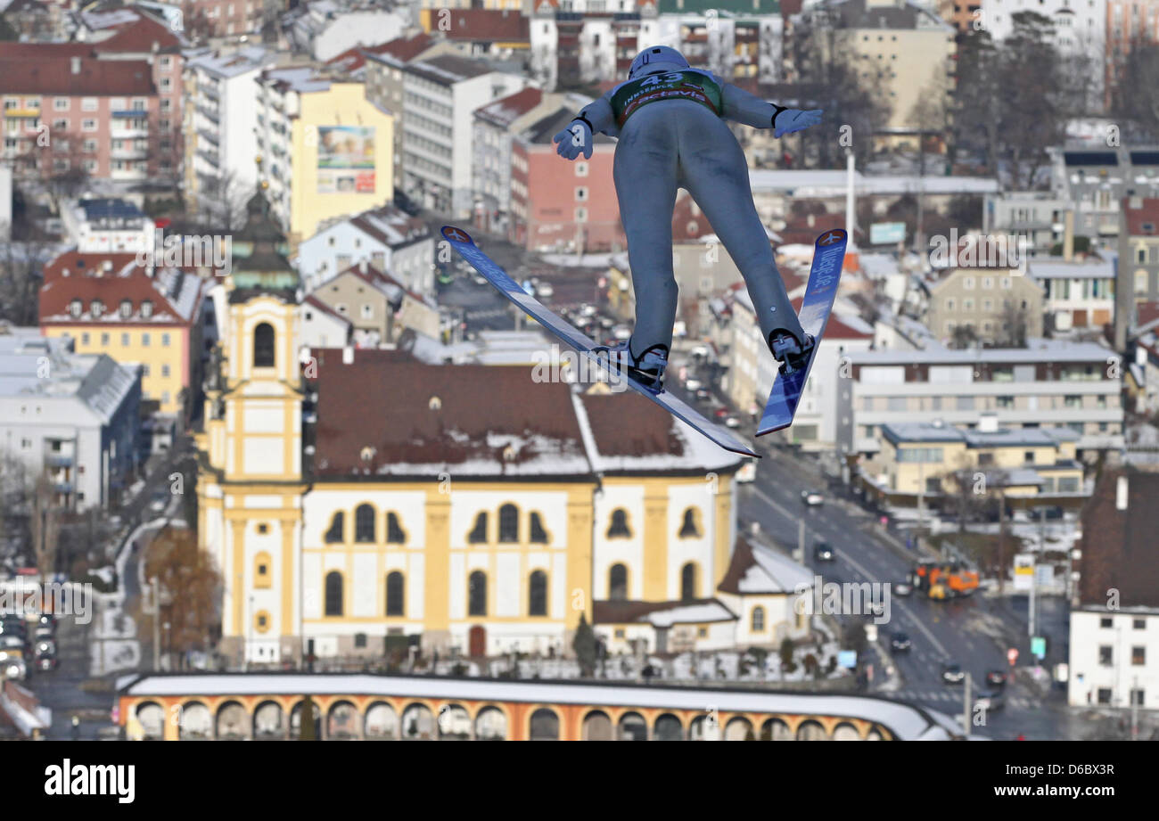 German ski jumper Maximillian Mechler jumps during the third jump of the train round at on the Bergisel Ski Jump at the 60th Four Hills Tournament in Innsbruck, Austria, 03 January 2012. Photo: DANIEL KARMANN Stock Photo