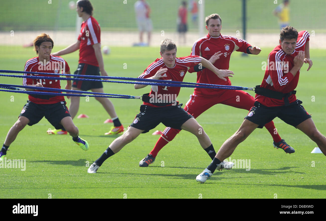 Players of the Bundesliga club FC Bayern Munich Takashi Usami (L-R), Toni Kroos, Manuel Neuer and Mario Gomez practice at a training camp in Doha, Qatar, 05 January 2012. From 02 to 09 January 2012 the team practices and prepares for the second leg of the Bundesliga season. Photo: Karl-Josef Hildenbrand Stock Photo