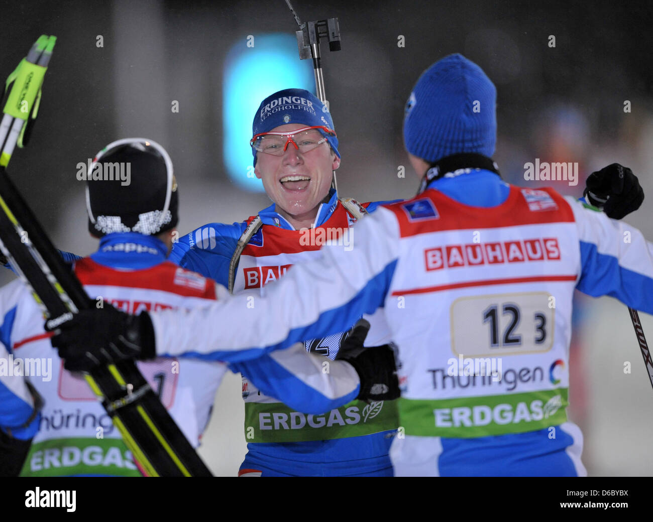 Italian biathlete Lukas Hofer (C) celebrates his victory with his team-mates Christian de Lorenzi (L) and Dominik Windisch (R) in the men's 4x7.5km relay of the Biathlon World Cup in Oberhof, Germany, 05 January 2012. Italy finished first, ahead of Russia and Sweden. Photo: Martin Schutt Stock Photo