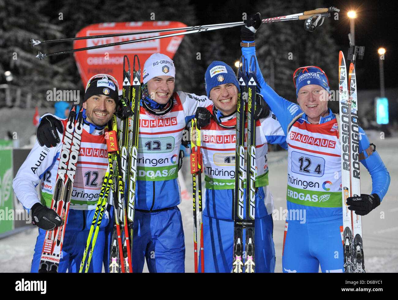 Italian biathletes Christian de Lorenzi (L-R), Markus Windisch, Dominik Windisch and Lukas Hofer celebrate their victory in the men's 4x7.5km relay of the Biathlon World Cup in Oberhof, Germany, 05 January 2012. Italy finished first, ahead of Russia and Sweden. Photo: Martin Schutt Stock Photo