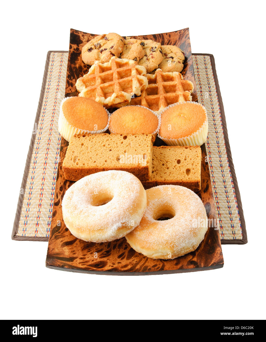 Cakes, cookies, donuts and waffles on the wooden plate Stock Photo