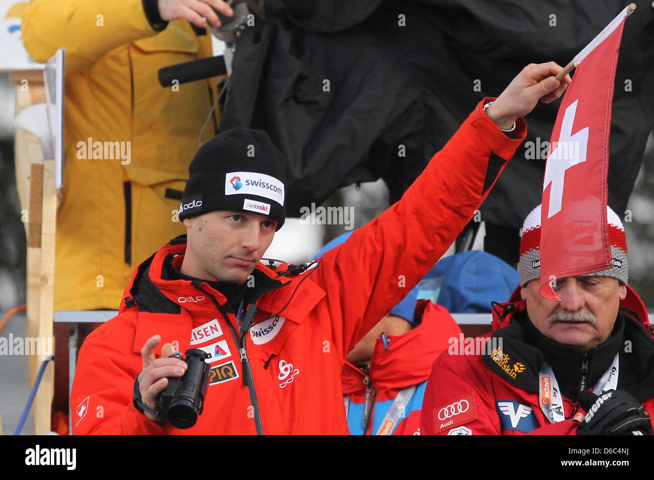 Swiss ski jumping coach Martin Kuenzle gives the signal to start a jump  during the third jump of the 60th Four Hills Tournament in Innsbruck,  Germany, 04 January 2012. Photo: Daniel Karmann