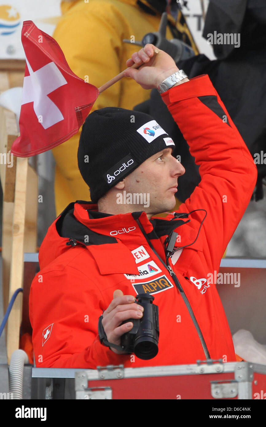 Swiss ski jumping coach Martin Kuenzle gives the signal to start a jump