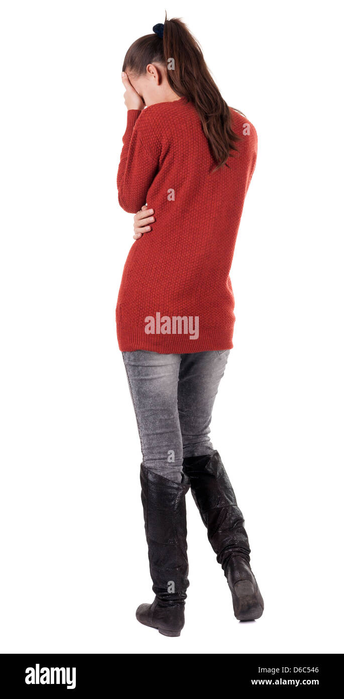 Back view of standing young beautiful woman. Brunette girl in jeans . Rear view people collection. Backside view of person. Stock Photo
