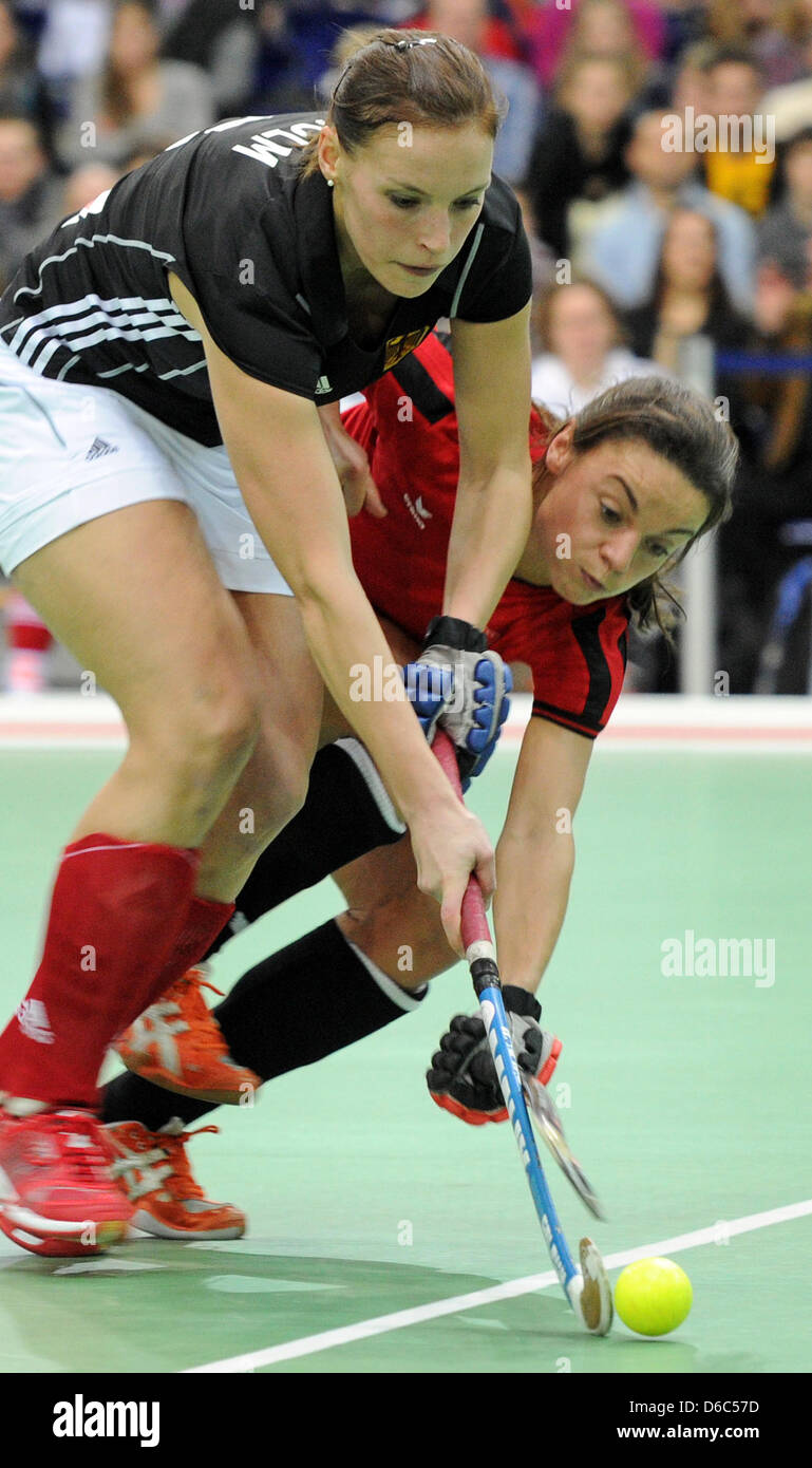 German Kerstin Holm (L) vies for the ball with Poland's Marlena Rybacha  during the Field Hockey Indoor European Championships match between Germany and Poland at the Arena in Leipzig, Germany, 14 January 2012. Photo: HENDRIK SCHMIDT Stock Photo