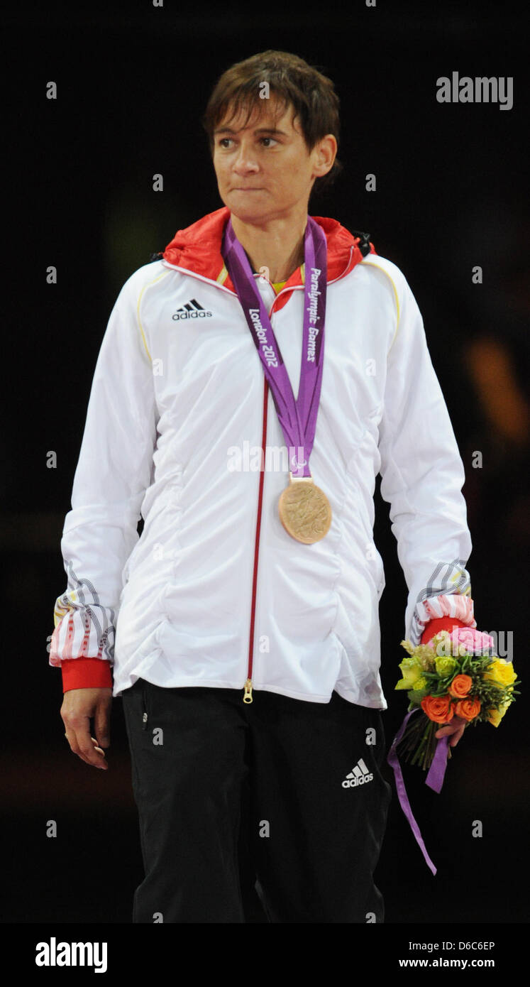 Jana Schmidt of Germany celebrates her bronze medal for the women's