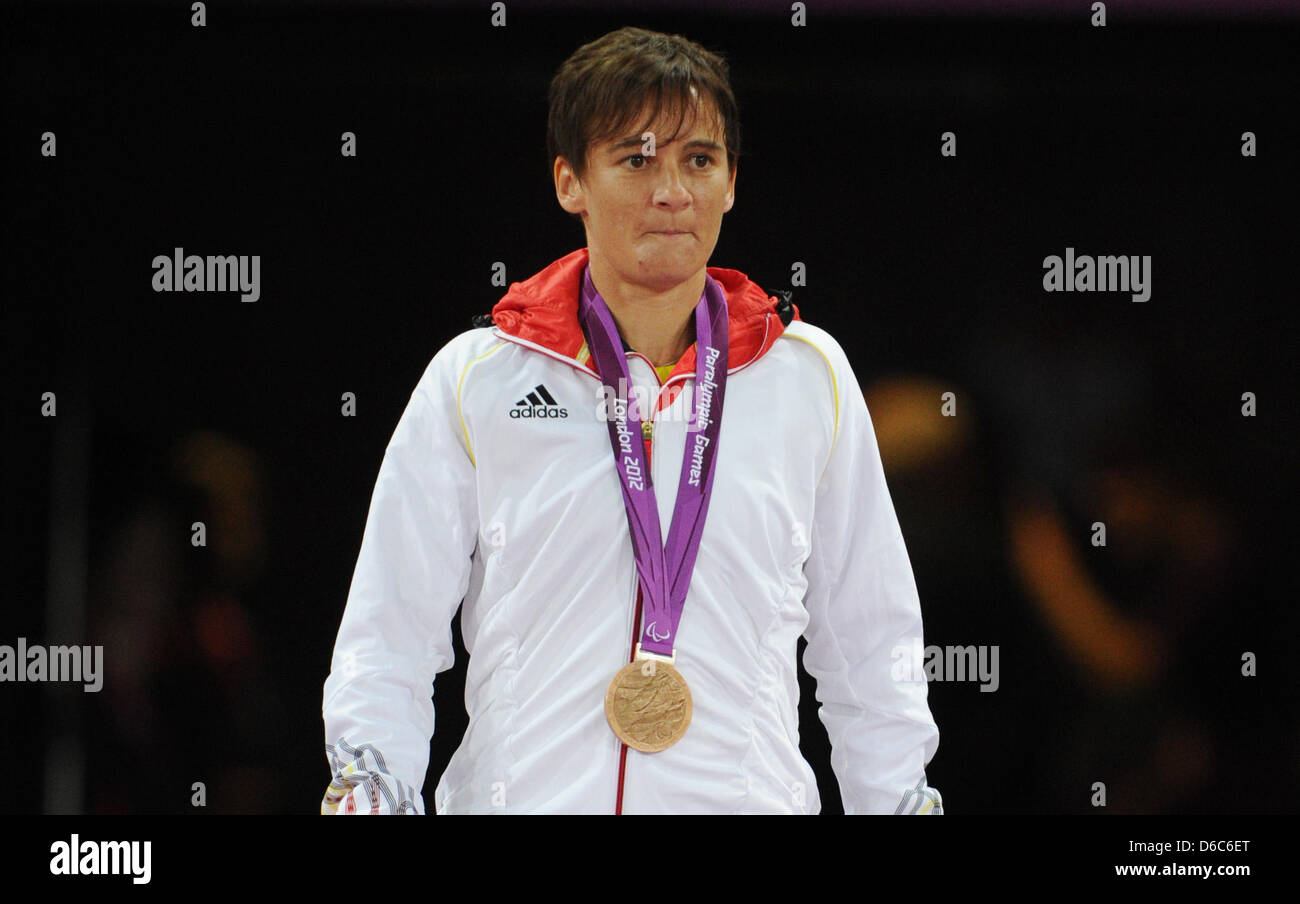 Jana Schmidt of Germany celebrates her bronze medal for the women's