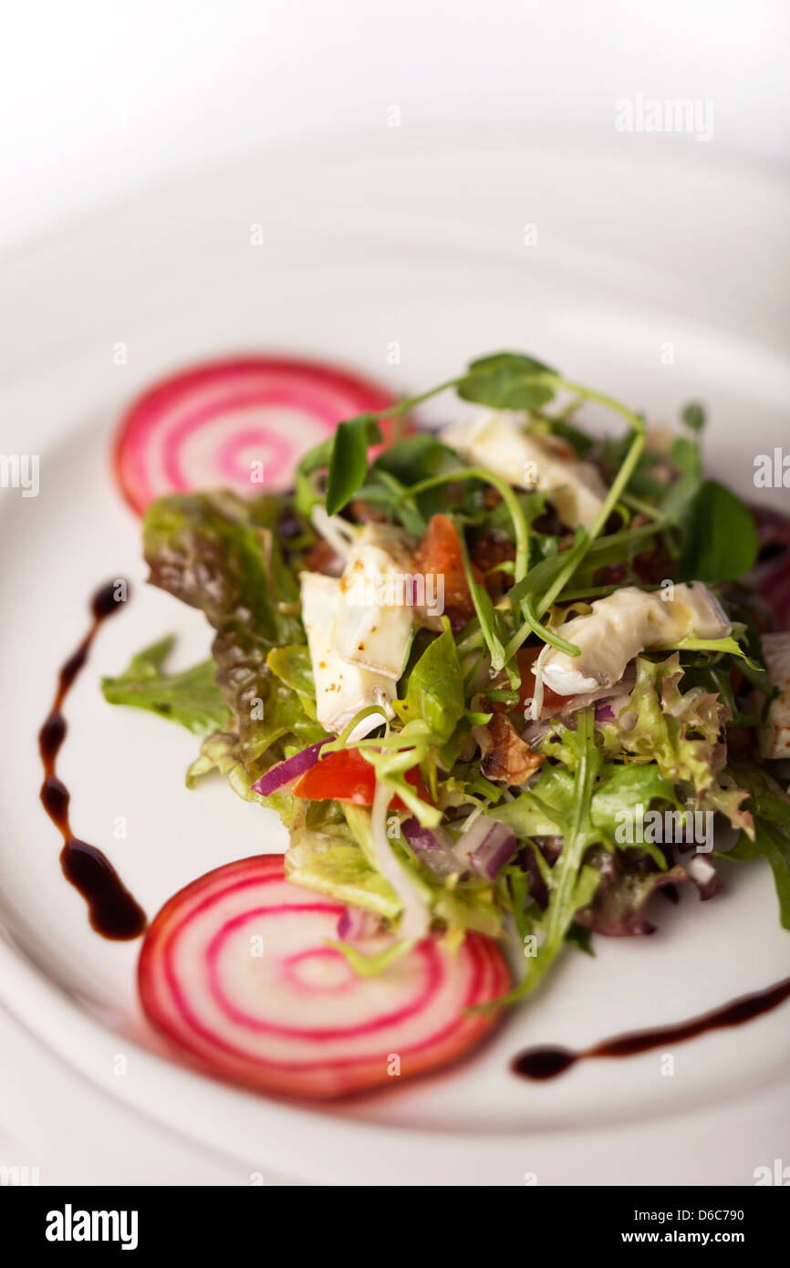 Fresh crispy salad with roasted Camembert cheese and beetroot Stock Photo