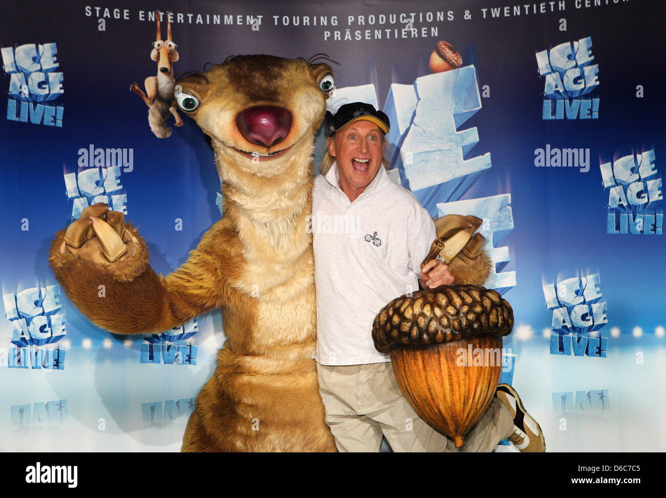 Comedian Otto Waalkes and Ice-Age character 'Sid' pose at a press conference on the arena-show 'Ice-Age Live! A Mammothy Adventure' in Hamburg, Germany, 05 September 2012. Waalkes will be the voice of Sid, just as in the German versions of the ICe-Age movies. The show will tout 14 German cities between November 2012 and March 2013. Photo: CHRISTIAN CHARISIUS Stock Photo