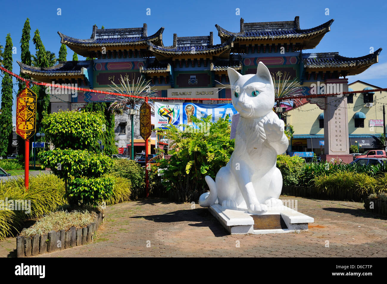 Cat statue and Chinese arch at entrance to Kuching, Sarawak, Borneo