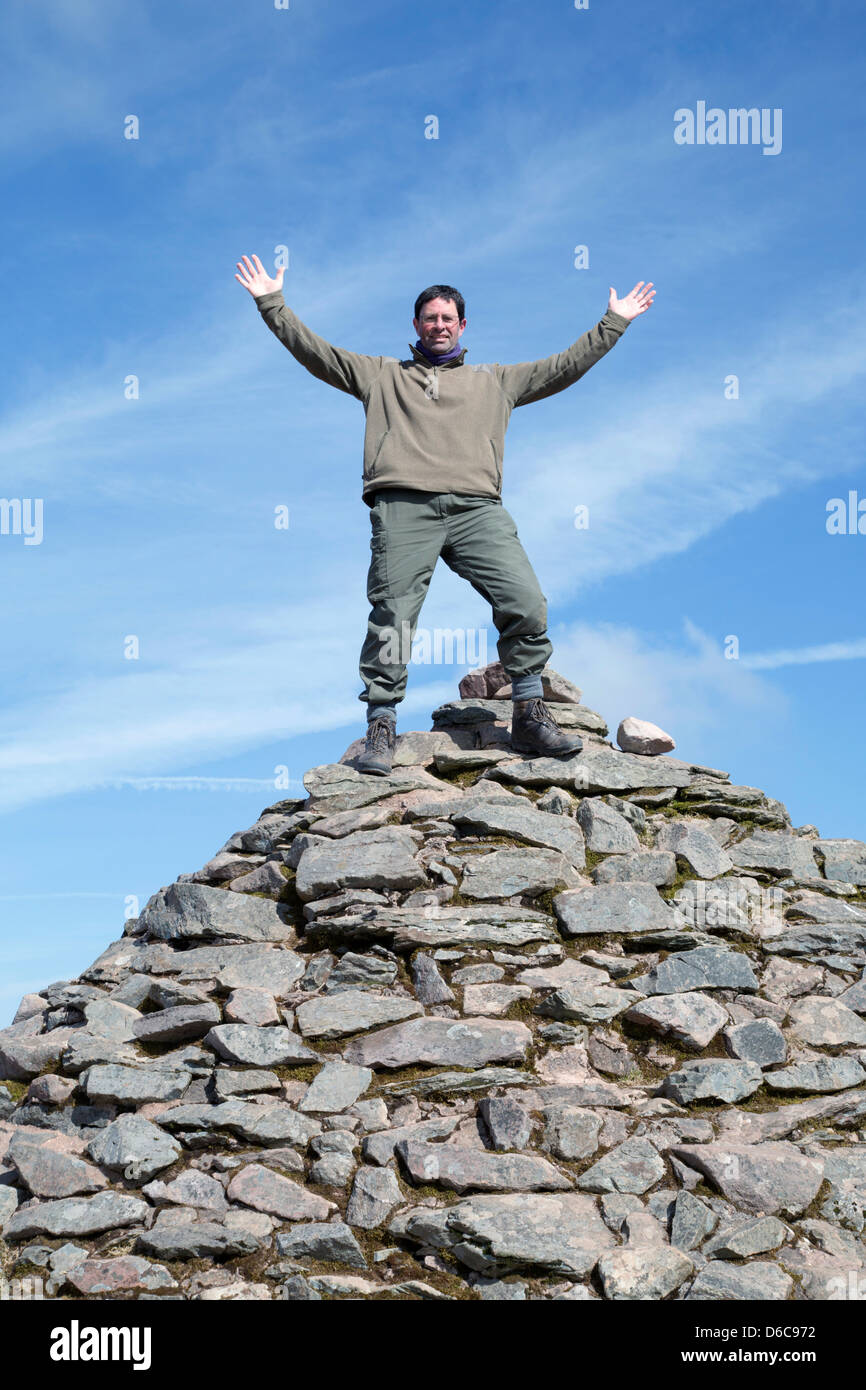 Dunkery Beacon; David Chapman on the Summit Cairn; Exmoor; UK Stock Photo