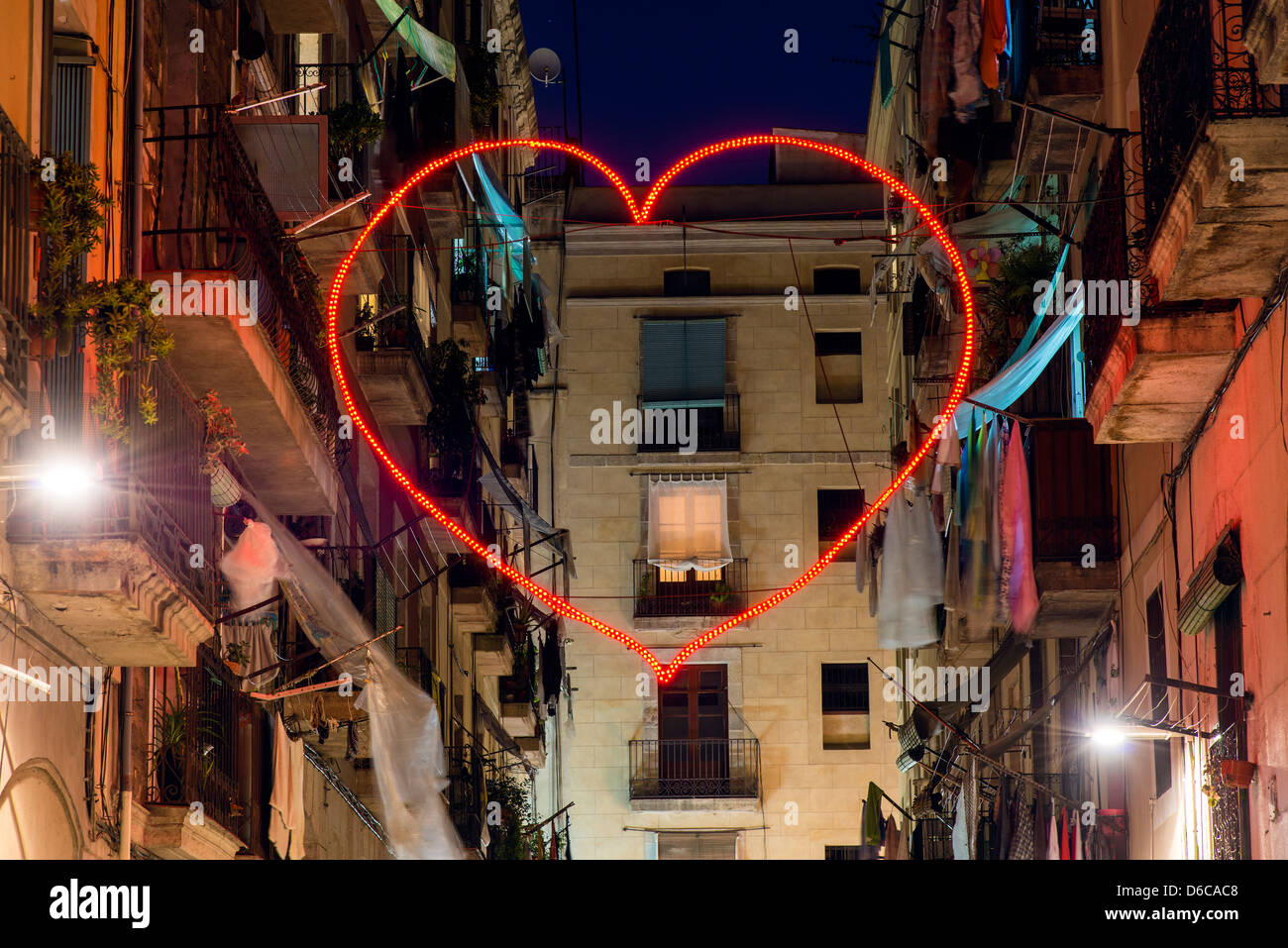 Red heart shaped neon light in Raval neighbourhood, Barcelona, Catalonia,  Spain Stock Photo - Alamy