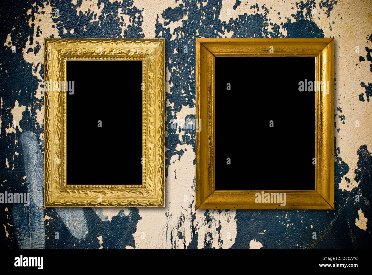 Grunge interior with vintage gold frames Stock Photo
