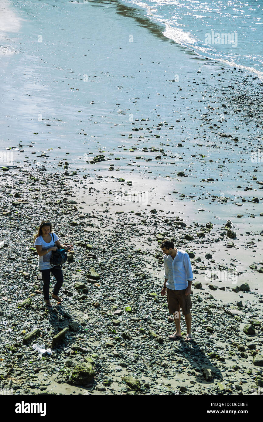 Man and Woman Beach Combing Thames Foreshore South Bank London England Stock Photo