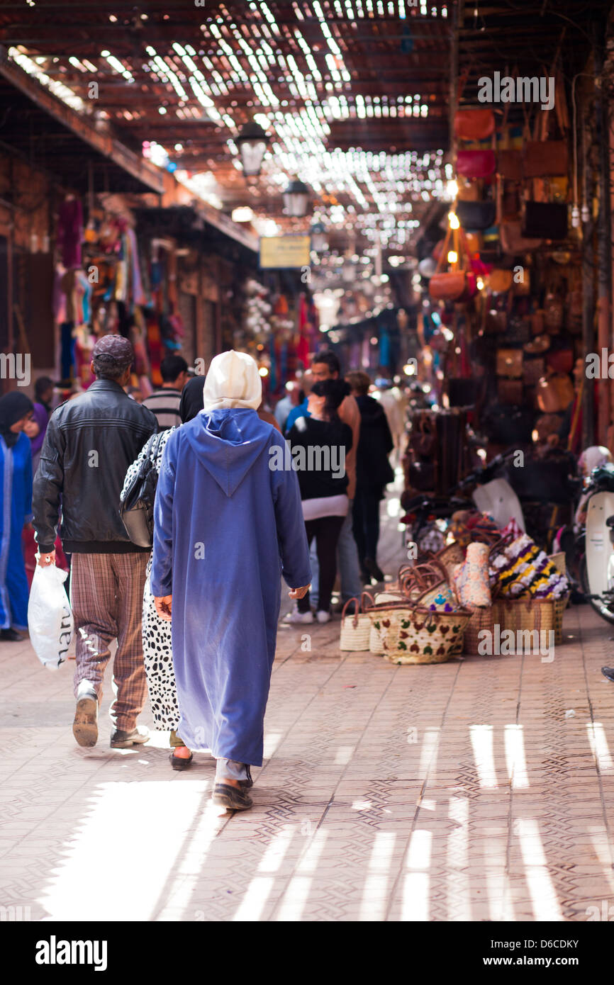 Walking through the souks near Djemaa El-Fna square, Marrakech, Morocco Stock Photo