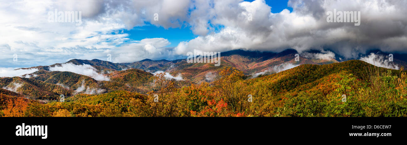 Clouds break over the Black Mountains Overlook at Mile Post 342 on the Blue Ridge Highway at the peak of fall in North Carolina. Stock Photo