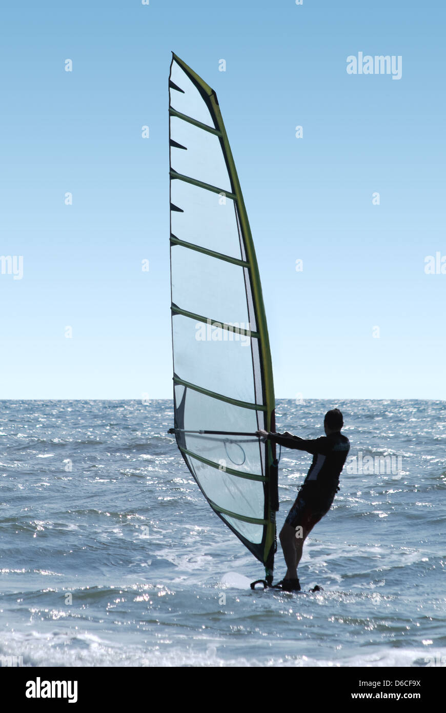 Silhouette of a windsurfer on a sea Stock Photo
