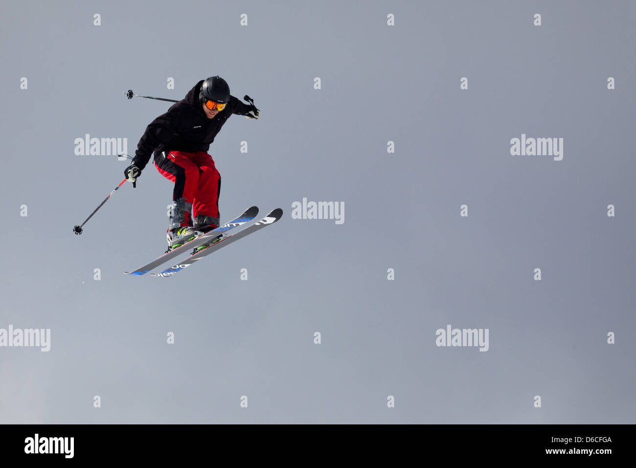 A skier makes a jump at Red Mountain resort, Canada Stock Photo