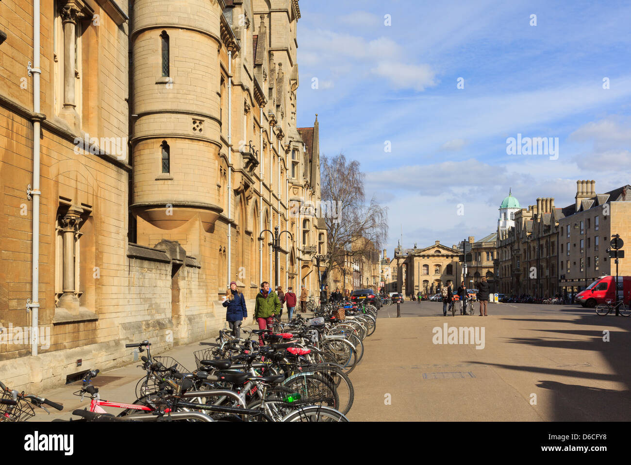 Oxford, Oxfordshire, England, UK. Street scene with bicycles parked in front of Balliol College Brackenbury Buildings (1867-68) Stock Photo