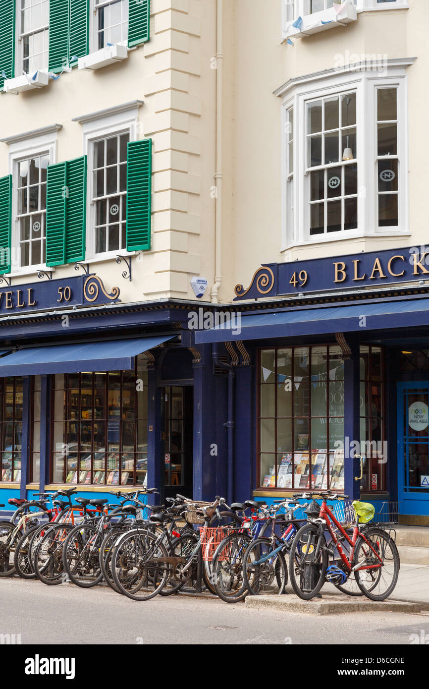 Bicycles parked outside Blackwell bookshop selling academic books for the University in Oxford Oxfordshire England UK Britain Stock Photo