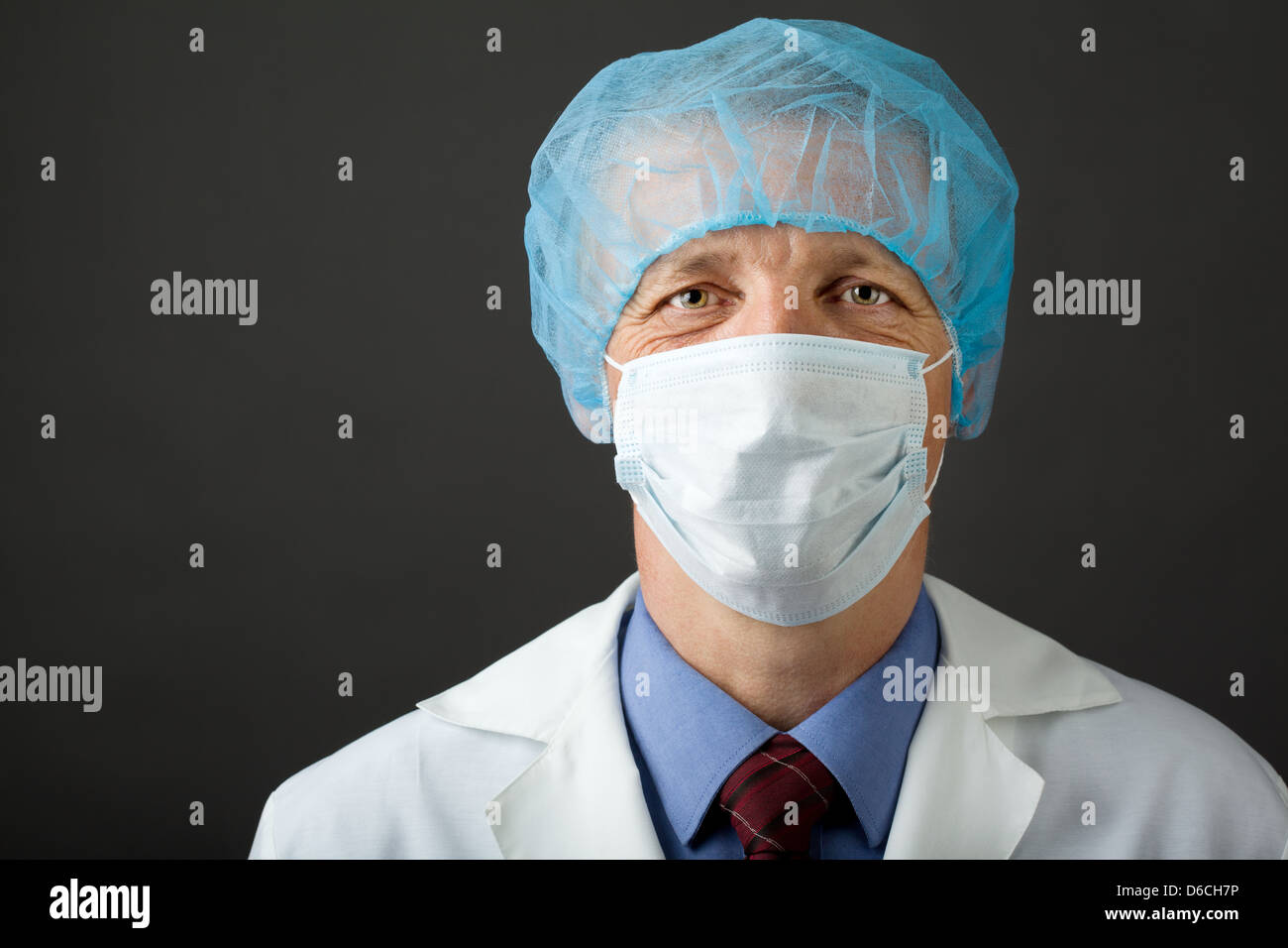 Male physician in mask and cap Stock Photo - Alamy