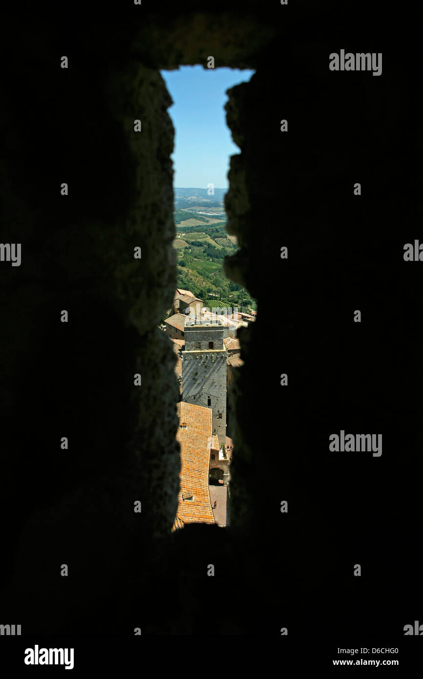 Arrow slit view of tower in San Gimignano Stock Photo