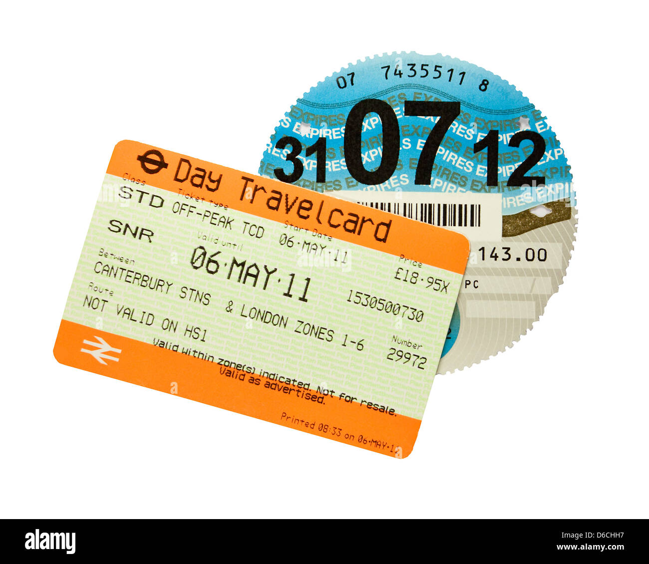 Take the Train or Drive Train Ticket and Tax Disc Stock Photo