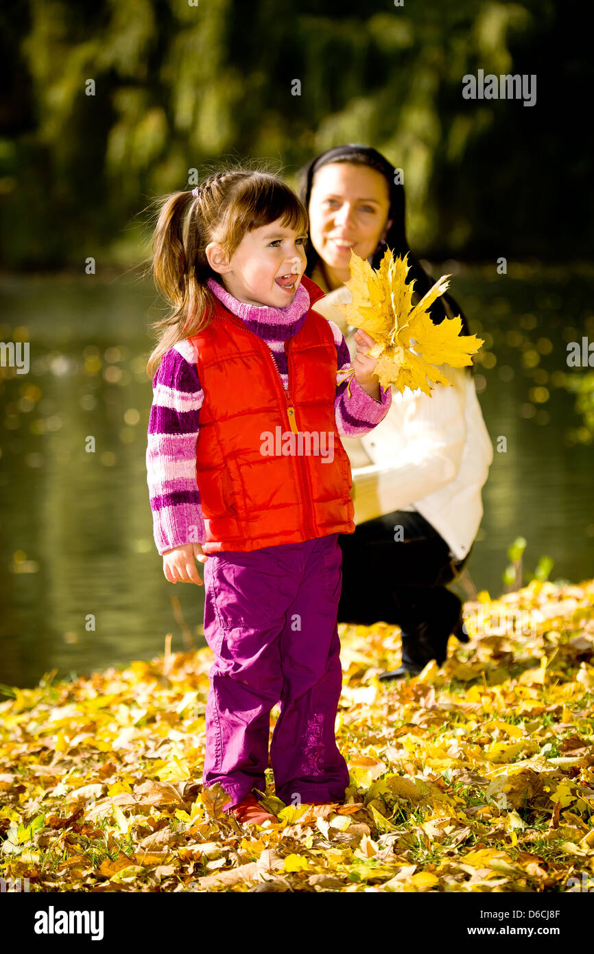 little girl in the autumn park Stock Photo - Alamy