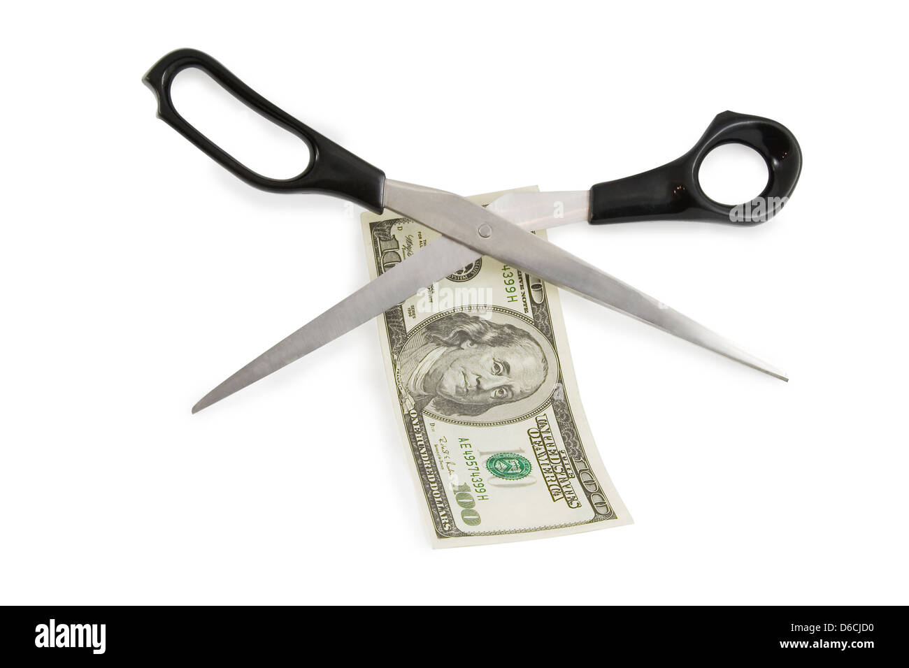 scissors cutting a 100 dollars banknote Stock Photo