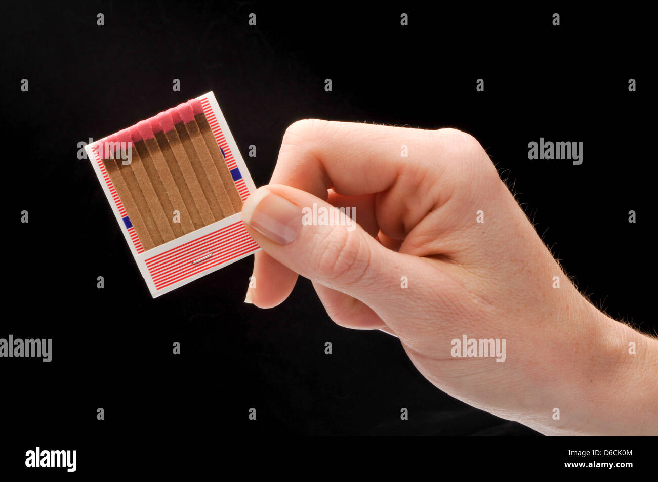 hand holding book of matches Stock Photo