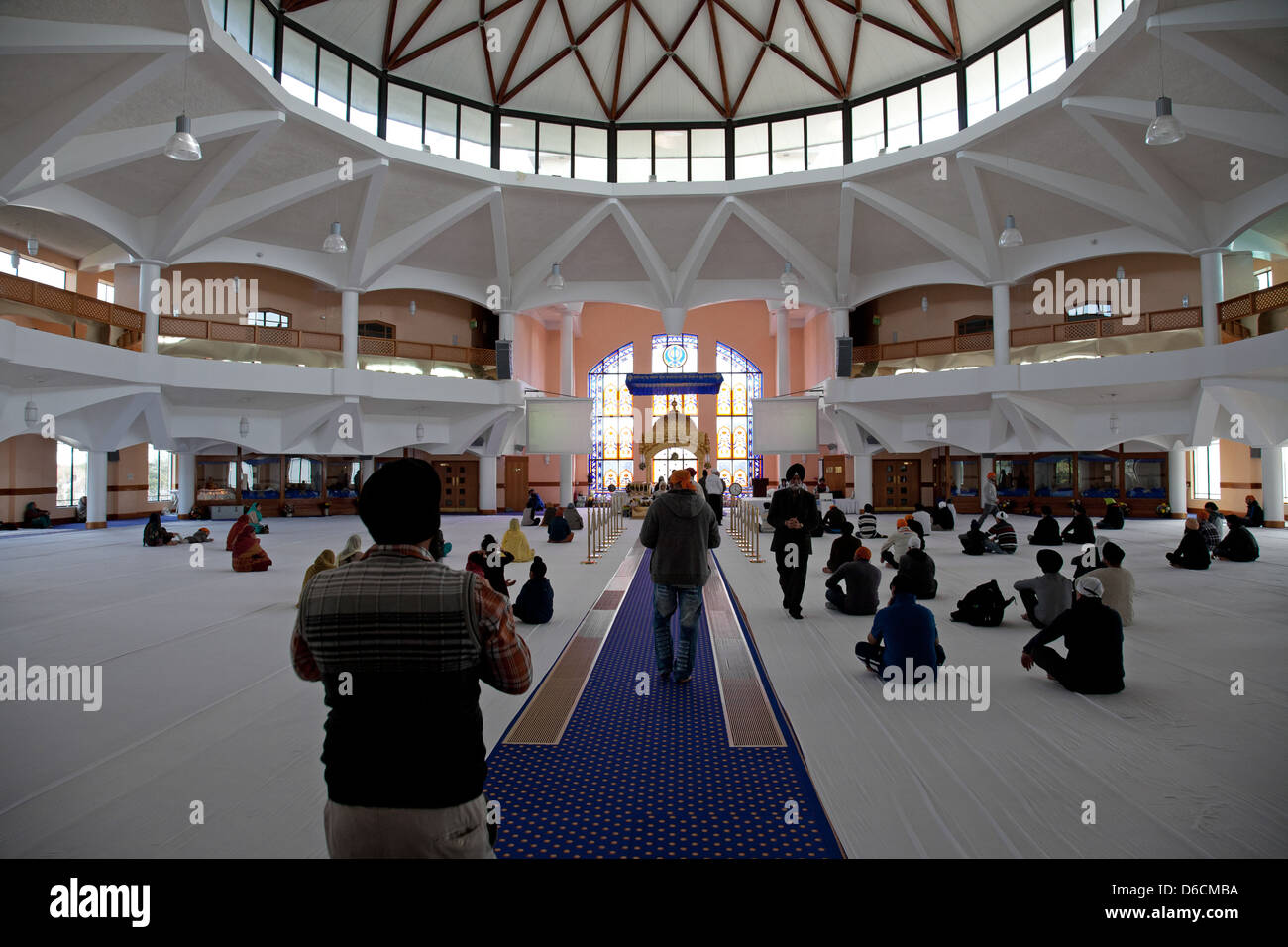 Prayer hall Interior  of The Gurdwara Sri Guru Singh Sabha Southall Stock Photo